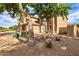 Inviting two-story home with a well-manicured front yard, decorative rock, and desert landscaping at 462 W Myrtle Dr, Chandler, AZ 85248