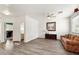 Bright living room featuring wood-look flooring, neutral walls, and comfortable seating furniture at 462 W Myrtle Dr, Chandler, AZ 85248