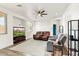 Spacious living room with wood-look floors, ceiling fan, lots of light, and comfortable seating at 462 W Myrtle Dr, Chandler, AZ 85248