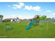 Virtual rendering of the backyard with grass, playground, and outdoor seating at 508 S Pasadena --, Mesa, AZ 85210