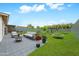 Backyard featuring a patio area with an outdoor living space and a play area for outdoor enjoyment at 508 S Pasadena --, Mesa, AZ 85210