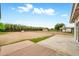 Wide backyard with concrete patio and fence with foliage at 508 S Pasadena --, Mesa, AZ 85210