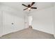 Comfortable bedroom features neutral carpet, ample closet space, and a ceiling fan at 508 S Pasadena --, Mesa, AZ 85210