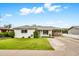 Charming single-story home with well-manicured lawn and covered carport at 508 S Pasadena --, Mesa, AZ 85210