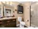 Lovely bathroom with stylish vanity, granite countertop, toilet, and tiled shower at 5350 E Deer Valley Dr # 3274, Phoenix, AZ 85054