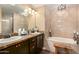Elegant bathroom with dual sinks, granite countertops, and a relaxing soaking tub at 5350 E Deer Valley Dr # 3274, Phoenix, AZ 85054