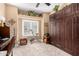 Well-lit bedroom featuring a window with shutters, a desk, and plenty of space at 5350 E Deer Valley Dr # 3274, Phoenix, AZ 85054