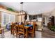 Traditional dining room with a wood table, wood chairs, and chandelier overlooking the kitchen at 5350 E Deer Valley Dr # 3274, Phoenix, AZ 85054