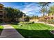Lush green space with manicured landscaping and pathway within the community at 5350 E Deer Valley Dr # 3274, Phoenix, AZ 85054
