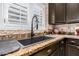 Kitchen sink with dark cabinets and granite countertops at 5350 E Deer Valley Dr # 3274, Phoenix, AZ 85054
