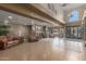 Elegant lobby area with tiled flooring, leather seating, stone pillars, and a grand entrance, creating a welcoming space at 5350 E Deer Valley Dr # 3274, Phoenix, AZ 85054