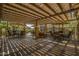 Inviting covered outdoor seating area with comfortable chairs, tables, and overhead shade structure at 5350 E Deer Valley Dr # 3274, Phoenix, AZ 85054
