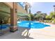 Community pool with water fountain, shaded seating, and views of nearby apartments, ideal for relaxation at 5350 E Deer Valley Dr # 3274, Phoenix, AZ 85054