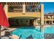Relaxing poolside view with shade umbrellas and tables for outdoor dining near the pool at 5350 E Deer Valley Dr # 3274, Phoenix, AZ 85054