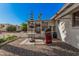 Private back patio with space for grilling and outdoor relaxation and desert landscaping at 5808 E Lawndale St, Mesa, AZ 85215