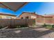 Backyard with gravel, a block wall, and space for landscaping or gardening at 5808 E Lawndale St, Mesa, AZ 85215