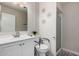 Well-lit bathroom features a shower, toilet, and modern vanity with a sleek design at 5808 E Lawndale St, Mesa, AZ 85215