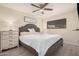Comfortable bedroom features neutral tones, a ceiling fan, and plenty of natural light at 5808 E Lawndale St, Mesa, AZ 85215