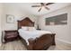 Cozy bedroom boasts an ornate wood bed frame, light floors, and a bright, inviting atmosphere at 5808 E Lawndale St, Mesa, AZ 85215
