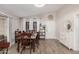 Cozy dining room with wood floors, a rustic table set, and ample natural light at 5808 E Lawndale St, Mesa, AZ 85215