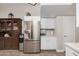 Well-equipped kitchen featuring stainless steel refrigerator and ample counter space at 5808 E Lawndale St, Mesa, AZ 85215