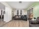 Inviting living room with wood-look flooring, neutral tones, and bright natural light at 5808 E Lawndale St, Mesa, AZ 85215
