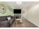 Comfortable living room with a wall mounted television, fireplace and modern decor at 5808 E Lawndale St, Mesa, AZ 85215