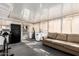 Inviting sun room features comfortable seating with bright natural light and exercise equipment at 5808 E Lawndale St, Mesa, AZ 85215