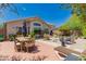 Spacious backyard with patio, dining area and well-maintained landscaping at 6031 N Milano Ct, Litchfield Park, AZ 85340