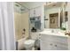 Cozy bathroom featuring a shower-tub combo and a white vanity at 6031 N Milano Ct, Litchfield Park, AZ 85340