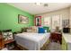 Bedroom featuring decorative pillows, bright walls, and window with blinds at 6031 N Milano Ct, Litchfield Park, AZ 85340