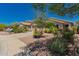 Beautiful single story house featuring low maintenance desert landscaping and a two-car garage at 6031 N Milano Ct, Litchfield Park, AZ 85340