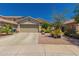 Charming single-story home featuring a two-car garage and low maintenance desert landscaping at 6031 N Milano Ct, Litchfield Park, AZ 85340