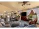 Inviting living room featuring comfortable seating, large windows, and an open layout at 6031 N Milano Ct, Litchfield Park, AZ 85340