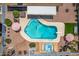 Aerial view of the backyard oasis with a sparkling pool, hot tub, outdoor seating, and desert landscaping at 6156 W Del Rio St, Chandler, AZ 85226