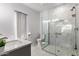 Modern bathroom features a glass-enclosed shower, double vanity, and stylish finishes at 6156 W Del Rio St, Chandler, AZ 85226