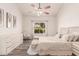 Inviting bedroom featuring wood floors, a neutral color palette, and ample natural light at 6156 W Del Rio St, Chandler, AZ 85226
