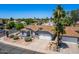 Charming single-story home featuring a well-maintained yard, mature landscaping, and a two-car garage at 6156 W Del Rio St, Chandler, AZ 85226