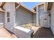 Inviting front patio featuring a seating area and security door, perfect for enjoying outdoor relaxation at 6156 W Del Rio St, Chandler, AZ 85226