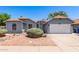 Charming single-story home featuring a desert landscape, a two-car garage, and a well-maintained yard at 6156 W Del Rio St, Chandler, AZ 85226