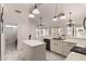 Open kitchen features an island, sleek appliances, and plenty of natural light from adjacent room at 6156 W Del Rio St, Chandler, AZ 85226