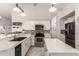 Contemporary kitchen features stainless steel appliances, granite countertops, and modern backsplash at 6156 W Del Rio St, Chandler, AZ 85226