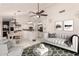Bright living room with neutral tones connected to dining area and kitchen at 6156 W Del Rio St, Chandler, AZ 85226