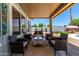 Relax on this comfortable, covered patio with views of the private, landscaped backyard at 6156 W Del Rio St, Chandler, AZ 85226