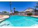 Beautiful pool with refreshing turquoise water, lounge chairs, and a charming desert landscaped backyard at 6156 W Del Rio St, Chandler, AZ 85226