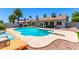 Outdoor living is easy with this pool, diving board, lounge area, and covered patio at 6156 W Del Rio St, Chandler, AZ 85226