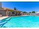 Inviting backyard oasis with a pristine pool, covered patio, hammock, and private desert landscaping at 6156 W Del Rio St, Chandler, AZ 85226