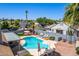 This property features a private backyard pool, lounge chairs, patio, and lush landscaping for ultimate relaxation at 6156 W Del Rio St, Chandler, AZ 85226