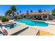 Relaxing backyard oasis boasting a sparkling pool, diving board, lounge chairs, and lush desert landscaping at 6156 W Del Rio St, Chandler, AZ 85226