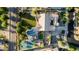 Aerial view showcases a backyard oasis with a sparkling pool, sport court, and lush landscaping at 6286 S Reseda St, Gilbert, AZ 85298